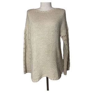 Sundance long sleeve crew neck sweater with pointelle open knit sleeves.